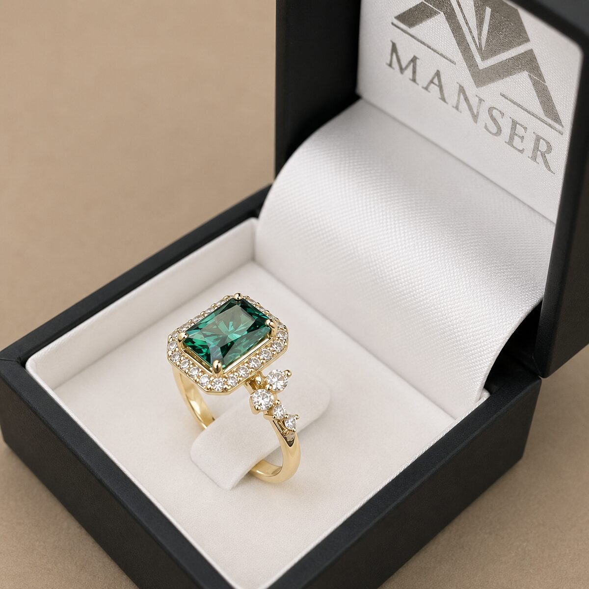 Green emerald-cut halo ring, yellow gold