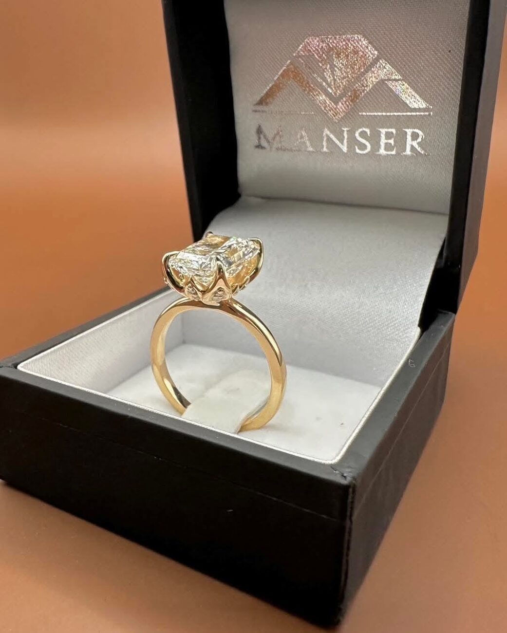 Radiant-cut diamond solitaire