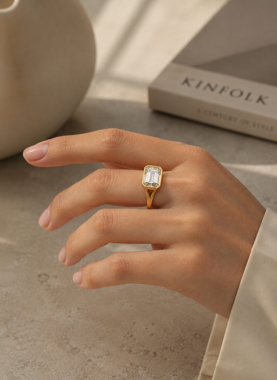 Emerald-cut bezel solitaire, 18ct gold